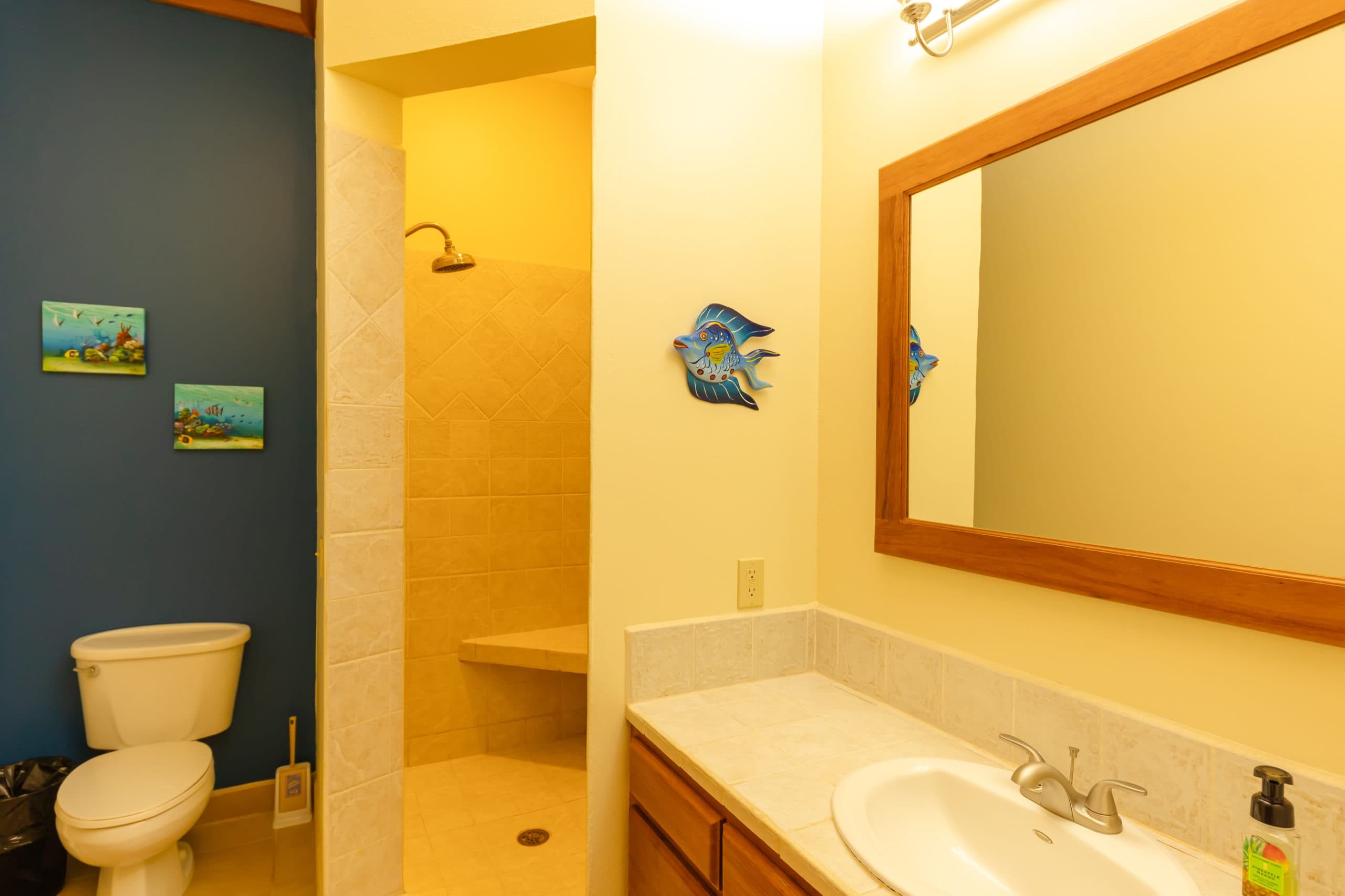 Stylish bathroom equipped with a walk-in shower combination, sleek sink, and all necessary amenities