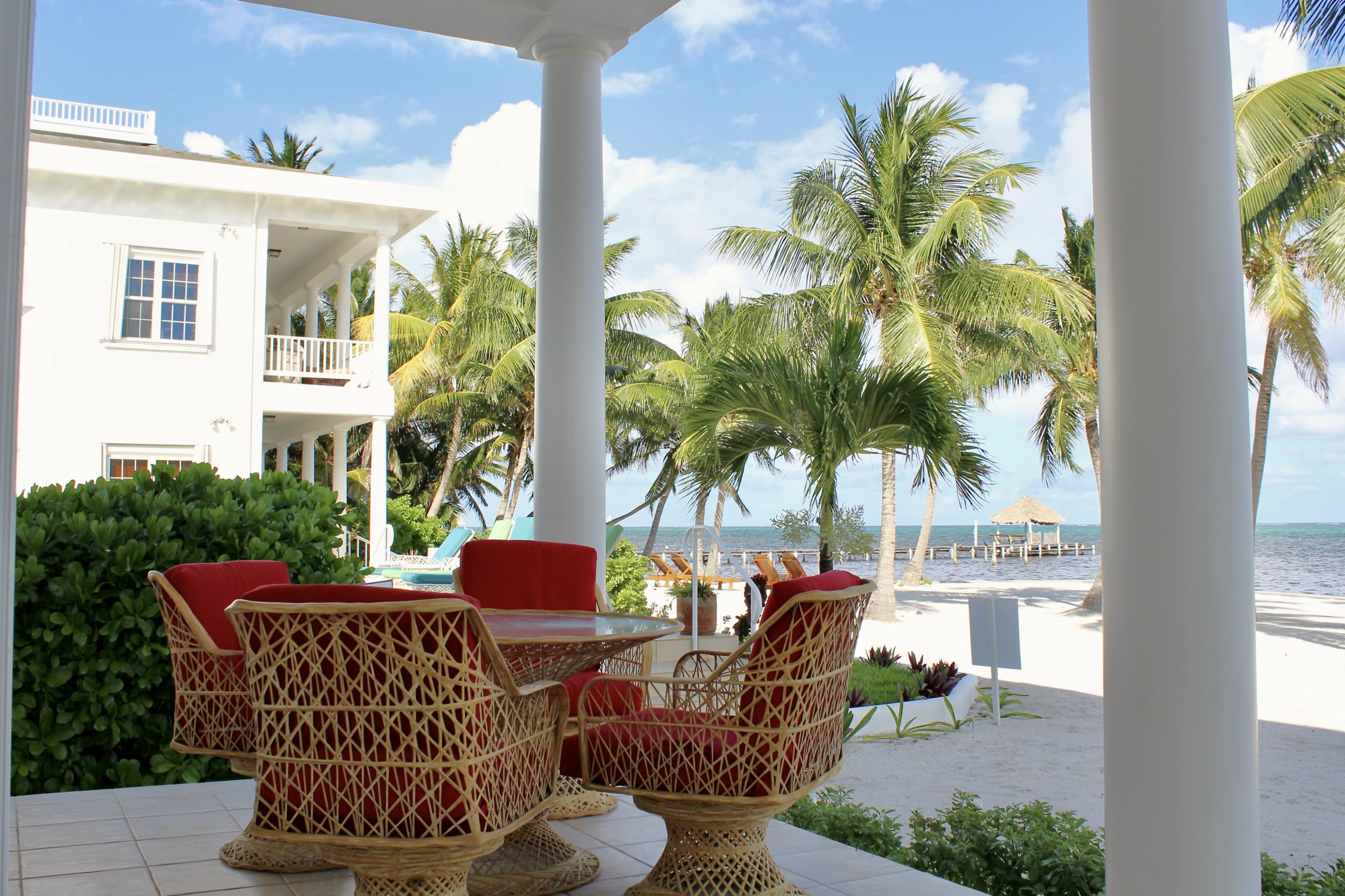 Beach Walkout Residence overlooking the Carribbean sea. Outdoor furniture and outdoor dining area