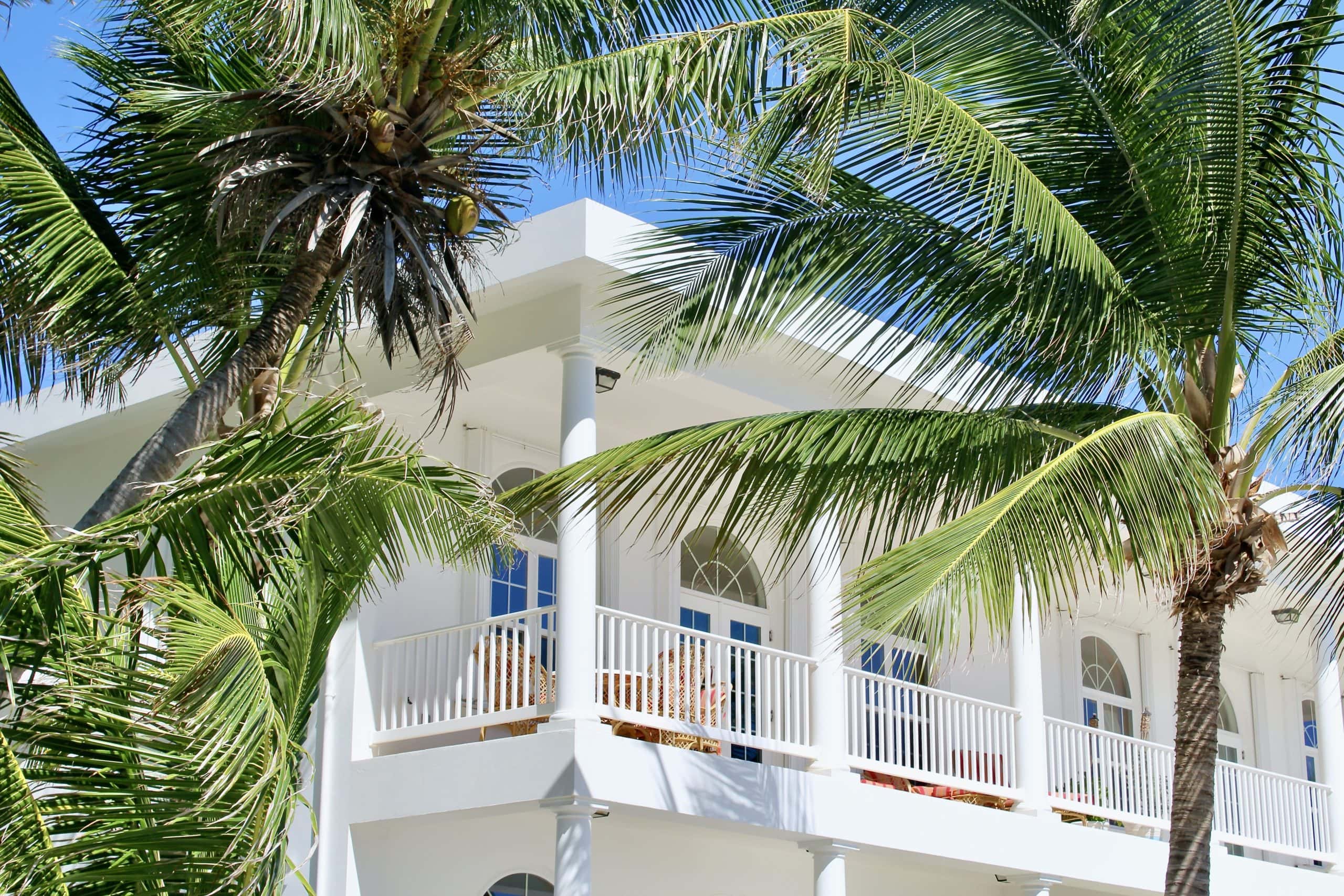 Second floor balcony overlooking the beach and sea, furnished with comfortable seating, providing a picturesque setting to relax, soak up the sun, and enjoy breathtaking ocean views.